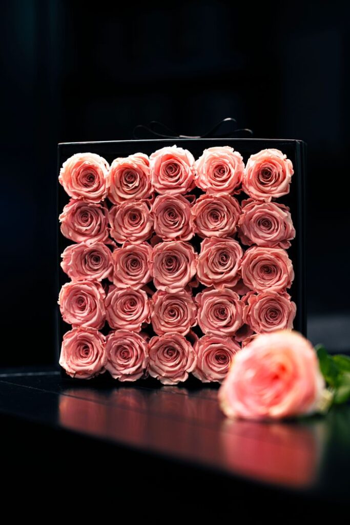 Chic arrangement of pink roses in a stylish box, photographed in Dubai.
