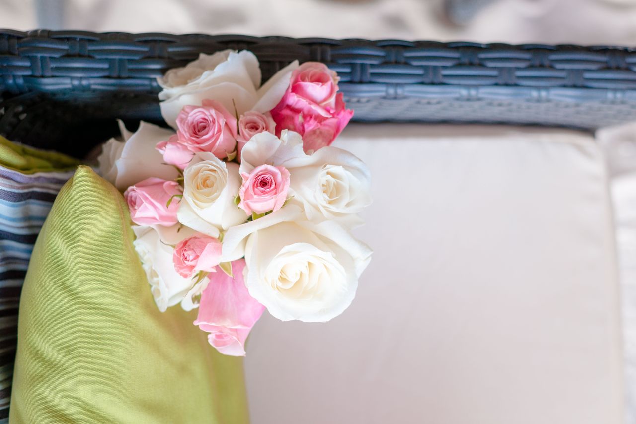 Overhead shot of a beautiful bridal bouquet with pink and white roses.